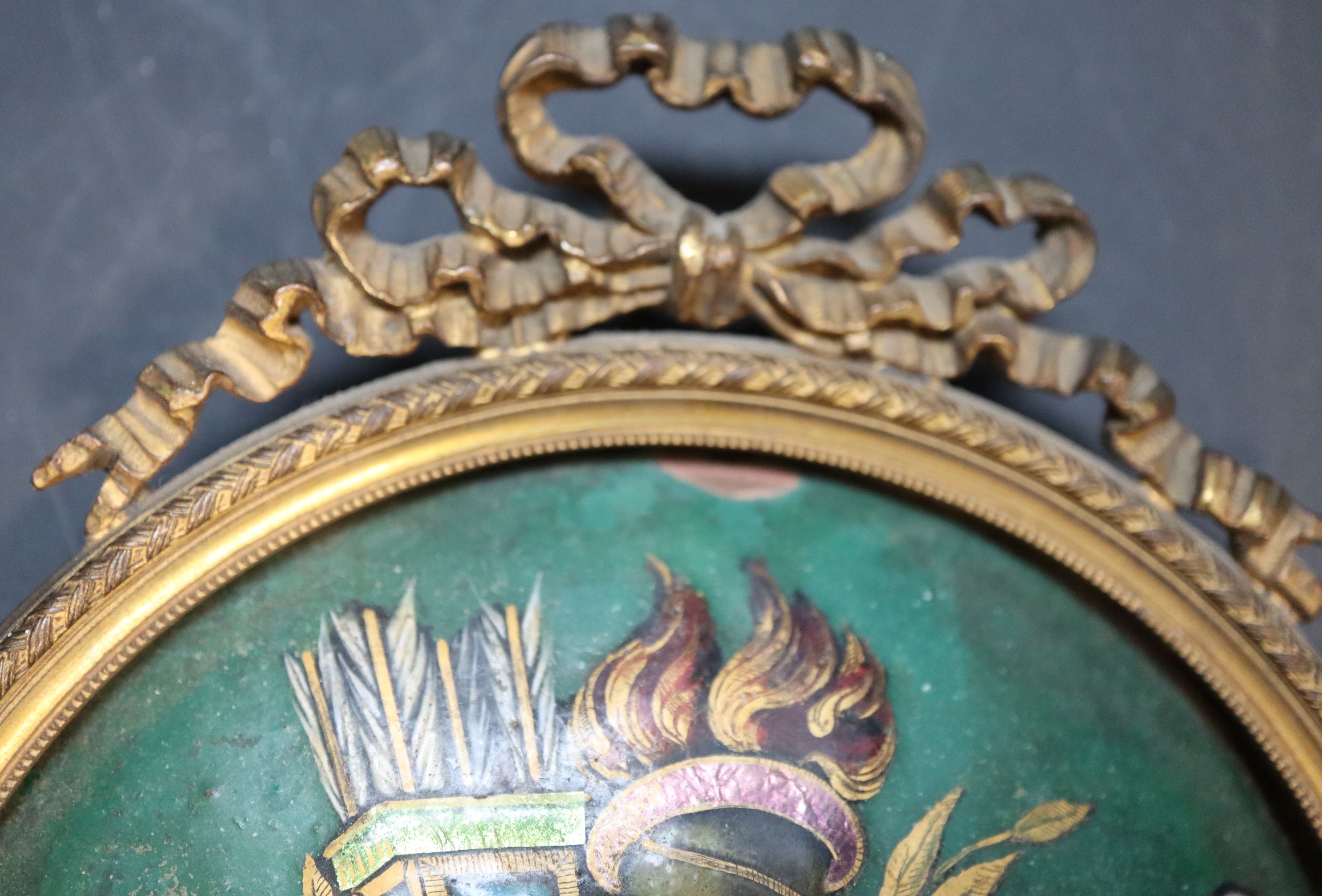 A 19th century French enamelled copper trophy plaque, in ormolu ribbon frame, width 12.5cm height 14.5cm